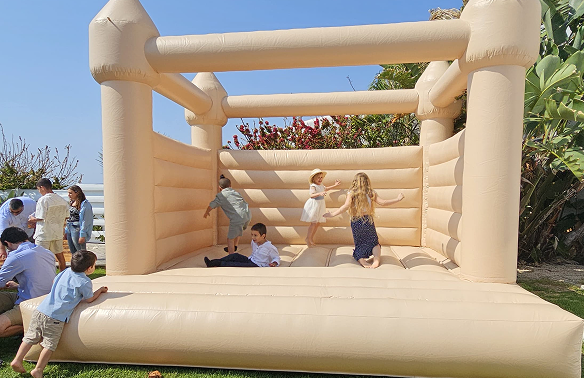 Kids playing in a bouncy castle